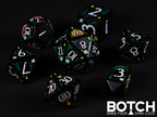 Black base color dice featuring graphics  of celestial symbols, from radiant stars to distant planets. White numbers. 