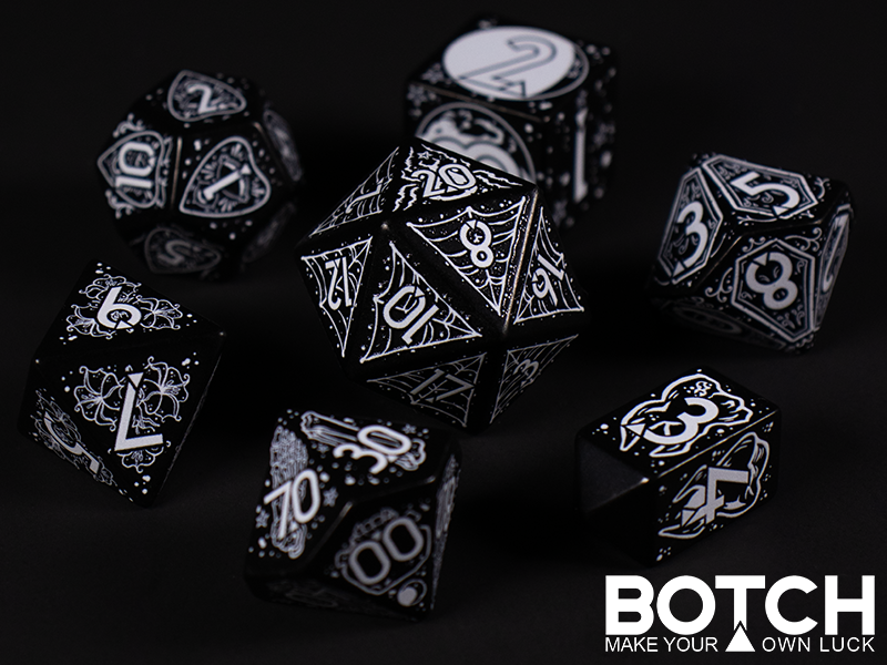 Black base color plastic with white color graphics in a goth theme. Spiders, coffins, the full moon, etc. 